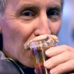 Kevin Gleim of Puyallup samples a donut-flavored beer, complete with maple icing, at the Port Townsend Strange Brewfest on Friday night. (Cydney McFarland/Peninsula Daily News)