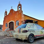 The Port Angeles team of Andy Audette and Nason Beckett and their 2000 Chevy Metro &ldquo;Pepito&rdquo; make a stop at an old mission at Sierrade San Francisco in the mountains of Baja California during the Baja 4000 Race.