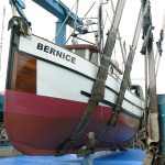 A 56-foot fishing vessel, Bernice, sits in its boat lift at the Boat Haven Marina in Port Townsend.