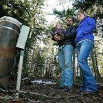Bud Breakey and his wife, Deborah, with their daughter Kaylin, 15 months, by the water well they paid to drill on property they own near Bellingham, where they hope to eventually build a house. (Ted S. Warren/The Associated Press)