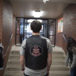 Jonathan Benecchii, a junior at Lewis and Clark and founder of The Little Guardians of the Children, a subset of the motorcycle organization Guardians of the Children, waits to greet group members at the Boys & Girls Club in Spokane in December. (Tyler Tjomsland/The Spokesman-Review via AP)