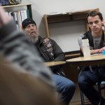 Jonathan Benecchi, right, a junior at Lewis and Clark and founder of The Little Guardians of the Children, leads a December club meeting in Spokane with Rob &ldquo;Daddy Rat&rdquo; Hoyt, left, of the motorcycle organization Guardians of the Children. (Tyler Tjomsland/The Spokesman-Review via AP)