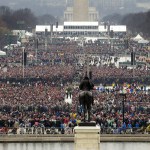 People stand on the National Mall to listen to the 58th Presidential Inauguration for President Donald Trump at the U.S. Capitol in Washington, D.C. (The Associated Press)