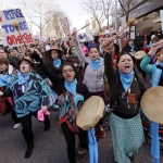 Native American singers and drummers lead a women&rsquo;s march of thousands as it arrives at the Seattle Center on Saturday in Seattle. (Elaine Thompson/The Associated Press)