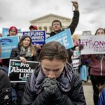Anti-abortion activists converge in front of the Supreme Court in Washington, D.C., on Friday during the annual March for Life. (Andrew Harnik/The Associated Press)