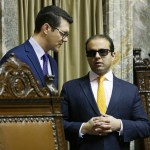 Senate Republican floor leader Joe Fain, R-Auburn, left, confers with Lt. Gov. Syrus Habib as Habib presides over the Senate on Friday in Olympia. (Ted S. Warren/The Associated Press)