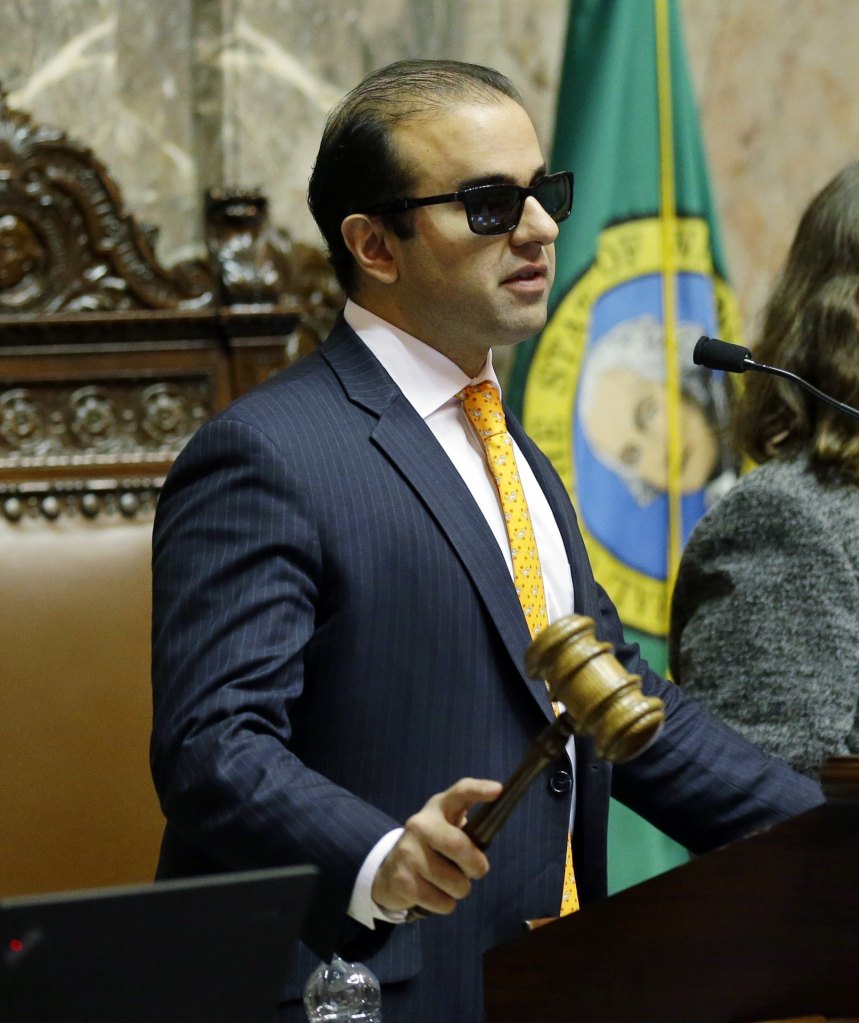 Lt. Gov. Syrus Habib bangs the gavel as he presides over the Senate on Friday in Olympia.(AP Photo/Ted S. Warren)