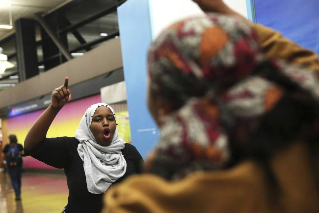 More than 1,000 people gather Saturday at Seattle-Tacoma International Airport to protest President Donald Trump&rsquo;s order that restricts immigration to the U.S. (Genna Martin/seattlepi.com via AP)