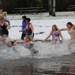 People braved the icy waters of Lake Pleasant on Sunday morning at the lake&rsquo;s Clallam County park for a New Year&rsquo;s Day polar plunge. (Lonnie Archibald/for Peninsula Daily News)