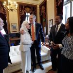 Gov. Jay Inslee embraces singer Judy Collins as they meet before his inaugural address to a joint session of the state Legislature on Wednesday in Olympia. Looking on are Collins&rsquo; husband, Louis Nelson, left; the Rev. Leslie Braxton; and Braxton&rsquo;s daughter, Karissa Braxton. Collins sang the national anthem and Braxton provided the invocation. (Elaine Thompson/The Associated Press)