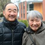 Clarence Moriwaki, president of Bainbridge Island Japanese American Community, stands with Lilly Kodama of Bainbridge Island, who was one of the first Japanese Americans forced into an internment camp 75 years ago. (Jesse Major/Peninsula Daily News)