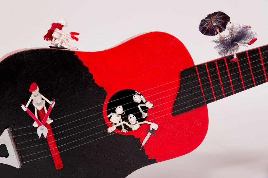 A guitar decorated by Jeanette Stehr-Green. (Juan de Fuca Foundation)