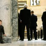 William Griffey, 3, left, grandson of state Rep. Dan Griffey, R-Allyn, waits outside the House chamber Monday on the opening day of the legislative session at the Capitol in Olympia. (Ted S. Warren/The Associated Press)
