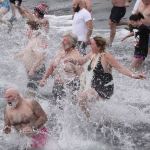 Dozens brave frigid air and water in polar plunges across North Olympic Peninsula