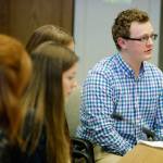Jaxon Owens, 17, right, editor-in-chief of the Viking Vanguard student newspaper at Puyallup High School, speaks during a Senate hearing at the Capitol on Thursday in Olympia. (Ted S. Warren/The Associated Press)