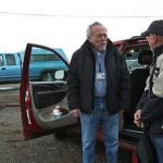 Jarvis Krumbein, left, picks up Clarence Jones at the Herron Island ferry landing on the Key Peninsula in Washington to drive him to his doctor appointment in Bremerton in December. (Mantai Chow/The News Tribune via AP)
