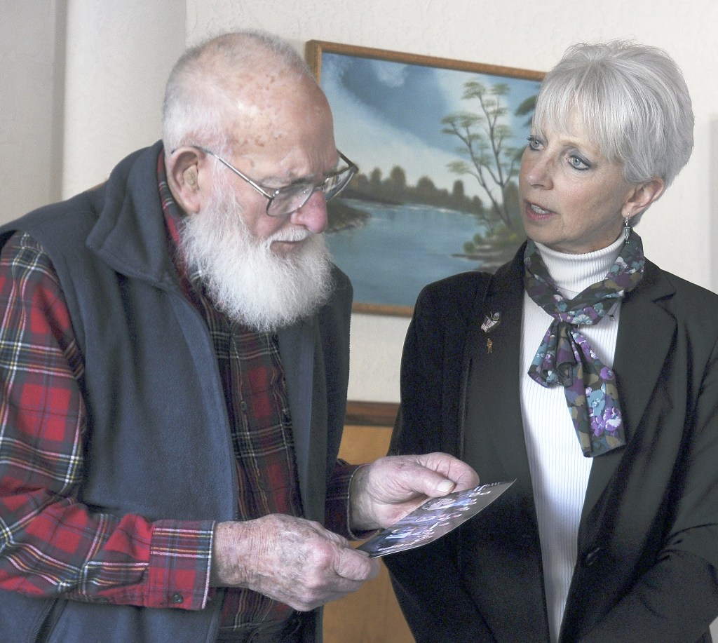 Pearl Harbor veteran Bob Rains talks with Wendy Miles, public affairs officer for the Naval Undersea Warfare Center Division-Keyport, in early January. (Michael Dashiell/Olympic Peninsula News Group)