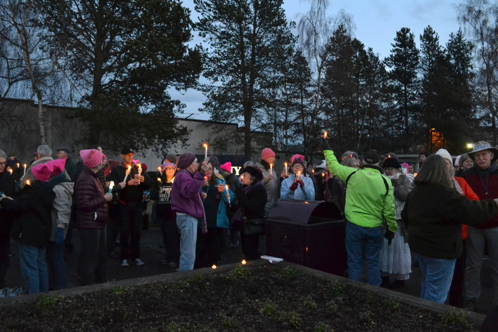 People gather last Saturday at the southeast corner of Washington Street and Sequim Avenue for women&rsquo;s rights. Organizers estimate more than 100 people attended. (Matthew Nash/Olympic Peninsula News Group)