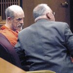 Riley E. White, left, consults with public defender Harry Gasnick during a status hearing in Clallam County Superior Court in Port Angeles in 2016. (Keith Thorpe/Peninsula Daily News)