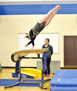 Port Angeles&rsquo; Sydney Miner competes in the vault at the Sub-districts held Thursday in Auburn. The Roughriders won the meet and will send their entire team to Districts.