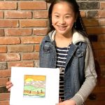 Lilly Sanders, 12, and her winning medal design for the North Olympic Discovery Marathon.
