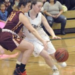 Keith Thorpe/Peninsula Daily News                                Port Angeles&rsquo; Lauren Lunt, right, and Kingston&rsquo;s Emma Eliason compete for the ball during their Feb. 2 game at Port Angeles High School.