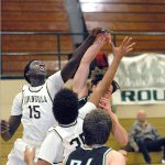 Keith Thorpe/Peninsula Daily News Peninsula&rsquo;s Omar Lo, left and Sam Velez, center, vie for a rebound with Shoreline&rsquo;s Ben Steinbrueck as Shoreline&rsquo;s Jacob Perkins, front, looks on during the second quarter on Wednesday at Port Angeles High School.