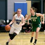 Steve Mullensky/for Peninsula Daily News Chimacum&rsquo;s Maddie Dowling drives around Vashon Pirate, Chloe Kuper, during a West Central District 3 pigtail playoff game in Chimacum on Friday.