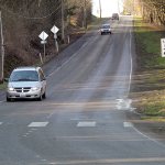 Vehicle traffic makes its way down Hill Street in Port Angeles, sharing the road with a connecting link of the Olympic Discovery Trail, designated as the shoulder of the roadway. (Keith Thorpe/Peninsula Daily News)