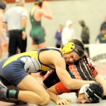 Lonnie Archibald/for Peninsula Daily News Forks&rsquo; Garrison Schumack, left, wrestles against Port Townsend&rsquo;s Henry Veittenhans at the Region 1 1A Wrestling Tournament in Hoquiam on Saturday. Schumack won match and went on to take first place in the 145-weight division, while Veittenhans finished fourth. Both wrestlers qualified for the Mat Classic at the Tacoma Dome Feb. 17-18.