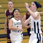 Keith Thorpe/Peninsula Daily News Clallam Bay&rsquo;s Mariah LaChester, front left, and Molly McCoy, right, chase after a loose ball as Lopez Island&rsquo;s Zoe Reinmuth looks on from behind during the first quarter of Tuesday night&rsquo;s playoff game played at Port Angeles High School.