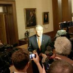 Gov. Jay Inslee talks to reporters Thursday in Olympia following a federal appeals court&rsquo;s refusal to reinstate President Donald Trump&rsquo;s travel ban. (Rachel La Corte/The Associated Press)