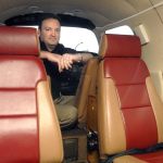 Zephyr Air president Jack Permison sits in the pilot&rsquo;s seat of a Piper PA-46 Malibu aircraft that his company proposes to use to provide air service between Port Angeles and Seattle. (Keith Thorpe/Peninsula Daily News)