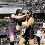 Lonnie Archibald/for Peninsula Daily News Kiara Pierson of Sequim (left) beat De La Cruz of Meridian for third place in the girls 120-pound 2A class at the Mat Classic XXIX.
