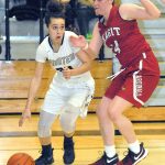 Keith Thorpe/Peninsula Daily News Peninsula&rsquo;s Sephora Yayouss slides past Skagit Valley&rsquo;s Emily Yost in the fourth quarter of Wednesday night&rsquo;s matchup in Port Angeles.