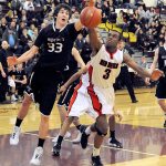 Lonnie Archibald/for Peninsula Daily News Neah Bay&rsquo;s Anthony Bitegeko (3) and Almira/Coulee-Hartline&rsquo;s Payton Nielsen go after a loose ball during their Class 1B state regional contest at Mount Tahoma High School on Saturday.