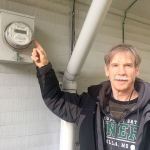 Jim Parker, general manager of the Jefferson County PUD, shows off the new digital meters that will replace the outdated mechanical models used by most PUD customers. (Cydney McFarland/Peninsula Daily News)