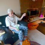 Richard Jones, 69, talks to reporters in his Sequim-area home Monday after being rescued from his car earlier that morning. He was trapped in his car for five days. (Jesse Major/Peninsula Daily News)