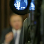 Washington state Sen. Doug Ericksen, R-Ferndale, is shown in a television camera viewfinder as he talks to reporters Thursday at the Capitol in Olympia. (Ted S. Warren/The Associated Press)