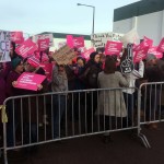 Supporters of Planned Parenthood hold a counter-protest as abortion opponents demonstrate outside Planned Parenthood in St. Paul, Minn., on Saturday. (Jeff Baenen/The Associated Press)