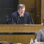 This March 12, 2013, still image taken from United States Courts shows Judge James Robart listening to a case at Seattle Courthouse in Seattle. (United States Courts via AP)