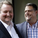 In this Nov. 15, 2016, photo, Curt Freed, left, and his husband, Robert Ingersoll, the couple who sued florist Barronelle Stutzman for refusing to provide services for their wedding, smile after a hearing before the state Supreme Court in Bellevue. (Elaine Thompson/The Associated Press)