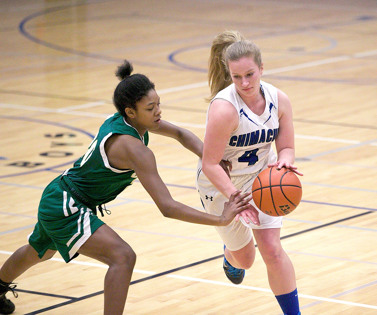 Steve Mullensky/for Peninsula Daily News Vashon&rsquo;s Kristi Walker tries to dislodge the ball away from Chimacum&rsquo;s Mechelle Nisbet during a West Central District 3 pigtail playoff game in Chimacum on Friday.