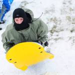 Cyras Mills, 13, sleds on a hill at Stevens Middle School in Port Angeles on Monday. (Jesse Major/Peninsula Daily News)