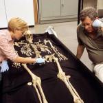 Smithsonian Institution physical anthropologists Karin Bruwelheide and Doug Owsley discuss the position of the Kennewick Man skeleton during an anatomical layout of the remains in this file photo. (Chip Clark/Smithsonian Institution)