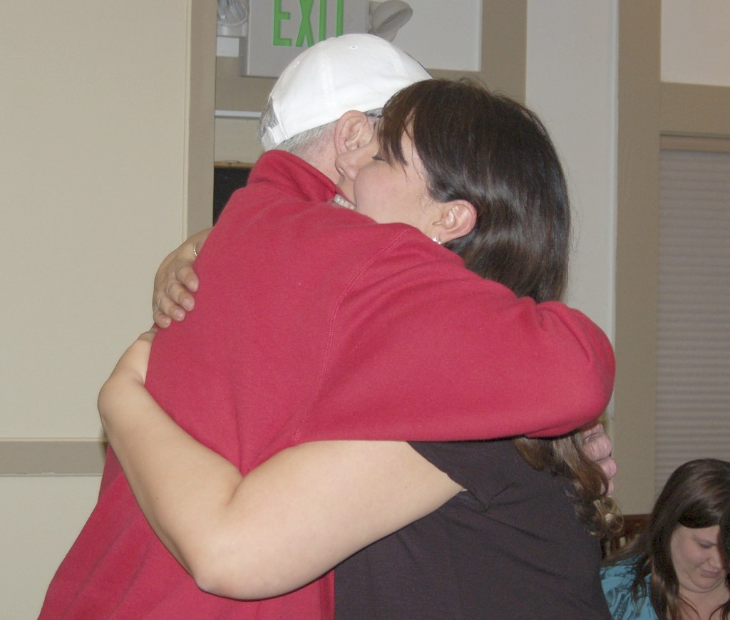 Sequim School District Superintendent Gary Neal hugs Jodi Minker of Citizens for Sequim Schools after the announcement of both levies having passed. (Erin Hawkins/Olympic Peninsula News Group)