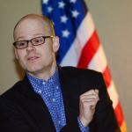 Clallam County Health Officer Chris Frank tells more than 30 people who attended the recent Port Angeles Citizens Action Network forum that the county&rsquo;s harm reduction efforts, such as the syringe exchange and distribution of naloxone, prevents the spread of disease and saves lives. (Jesse Major/Peninsula Daily News)