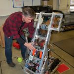 Sequim High School teacher and Robotics Club faculty adviser Brad Moore shows components of one of the robots the club constructed for last year&rsquo;s FIRST Robotics Competition. (Erin Hawkins/Olympic Peninsula News Group)