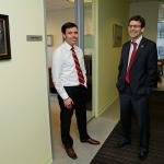 Washington state Solicitor General Noah Purcell, left, and Attorney General Bob Ferguson, right, pose Friday next to their adjoining offices in Seattle. (Ted S. Warren/The Associated Press)