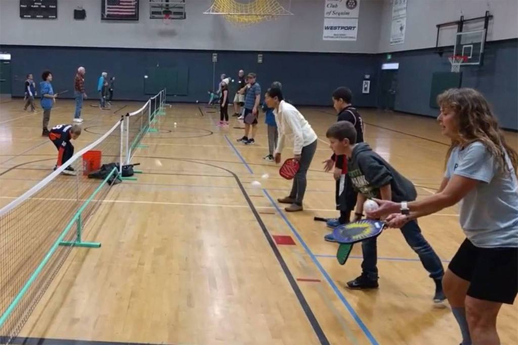 Charlie Pugh                                Sequim Picklers provide pickleball lessons on Tuesdays for students in the Sequim Boys & Girls Club.